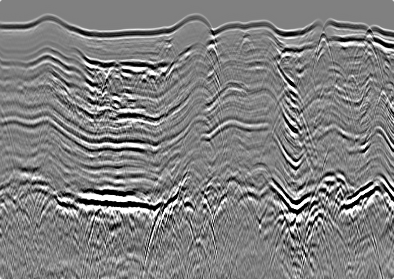 Stack section before deghosting in g-Platform, with the ghost notch flattening the spectrum and blurring the reflectors